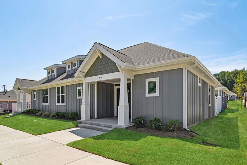 a house with a driveway and grass