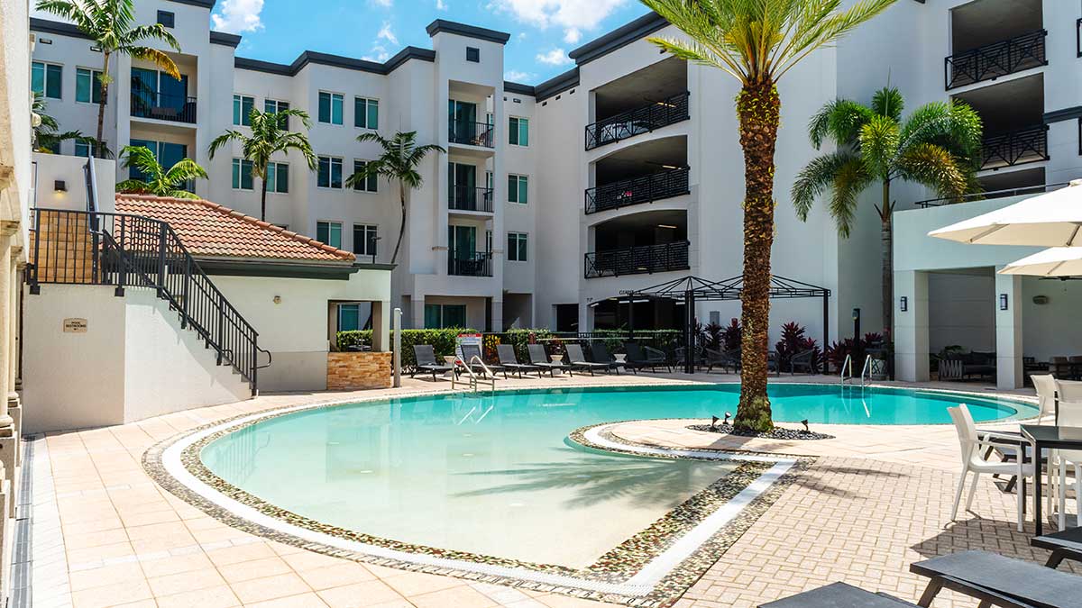 a swimming pool in front of a building