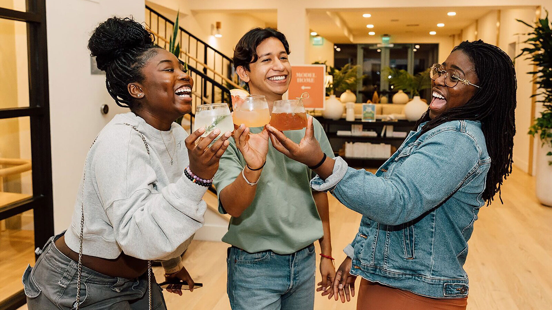 a group of women holding drinks