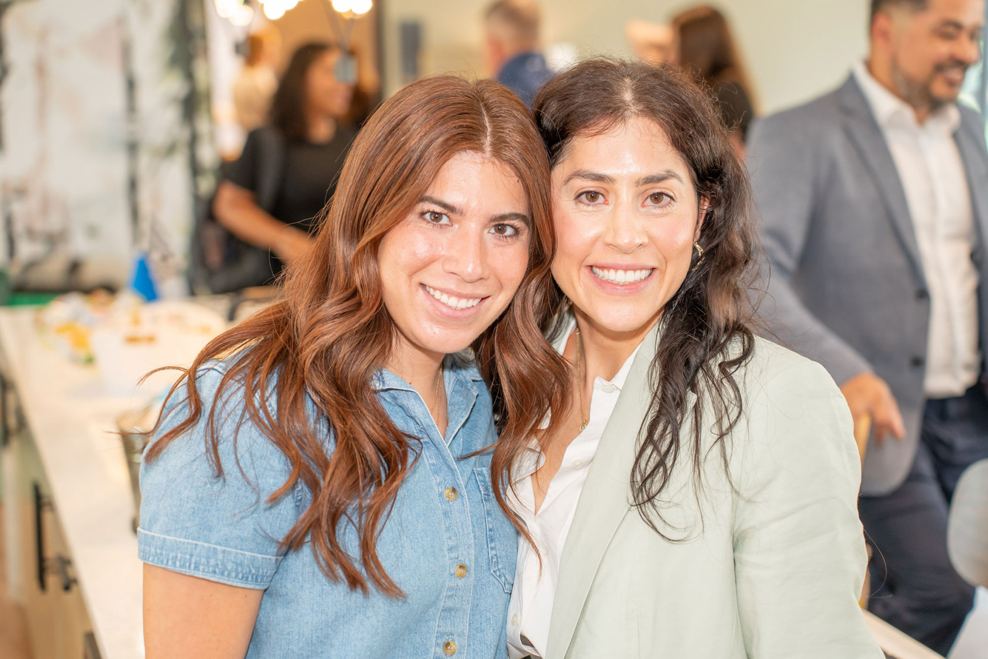 two women smiling at the camera